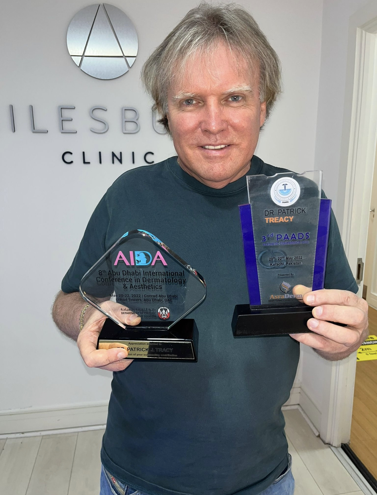 Dr Patrick Treacy holding the AIDA award